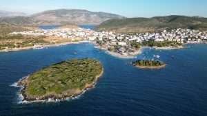 Aerial drone view of the Ksamil islands and turquoise Ionian sea on the Albanian Riviera, a top area for buying property in Albania